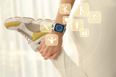 Image of Woman with smart watch during training indoors, closeup. Icons near device