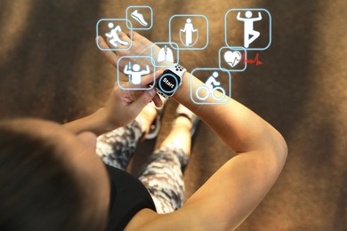 Image of Woman using modern smart watch during training outdoors, top view. Icons near device