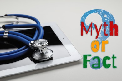 Image of Medical myths. Tablet and stethoscope near question mark with words on white background