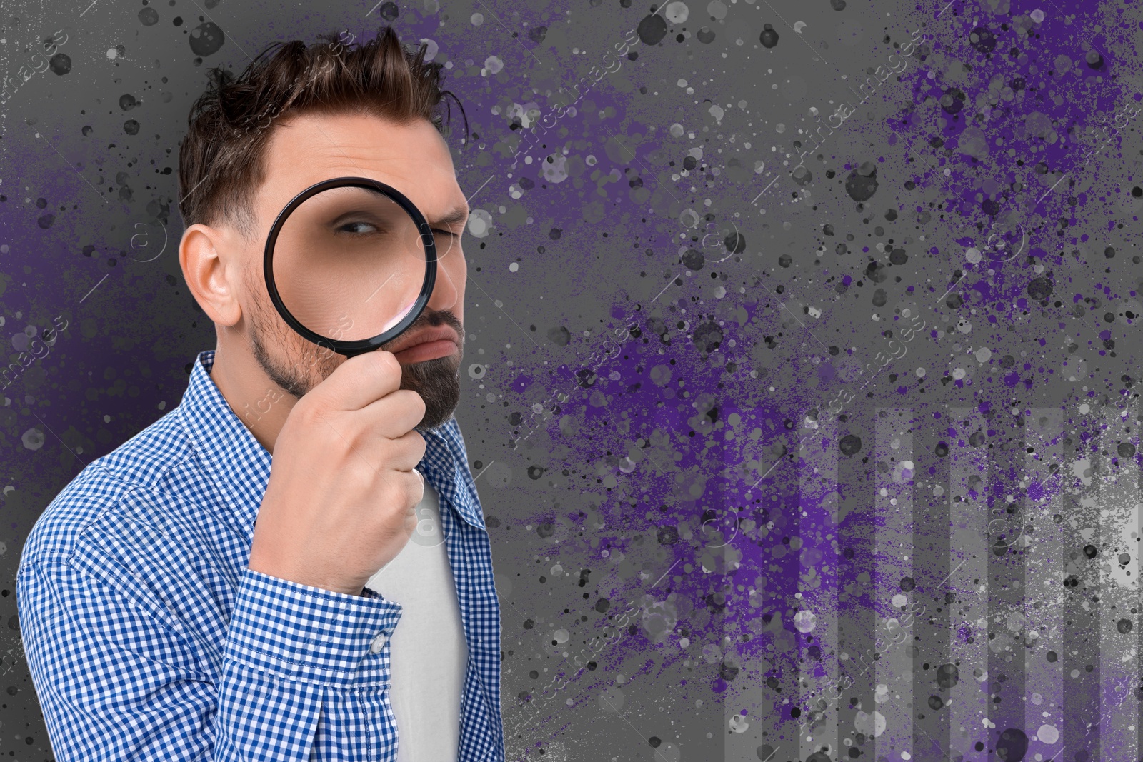 Image of Man looking through magnifier on color textured background