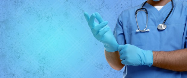 Image of Doctor wearing gloves on light blue background, banner design. Space for text