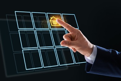 Image of Search for housing. Real estate agent touching virtual screen with building icon on black background, closeup