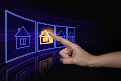 Search for housing. Woman touching virtual screen with building icons on black background, closeup