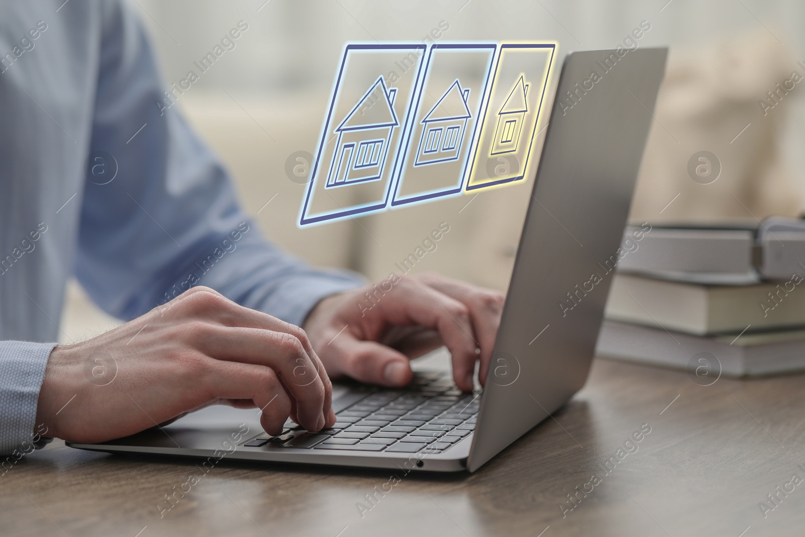 Image of Search for housing. Real estate agent using laptop at wooden table, closeup. Virtual screen with building icons over computer