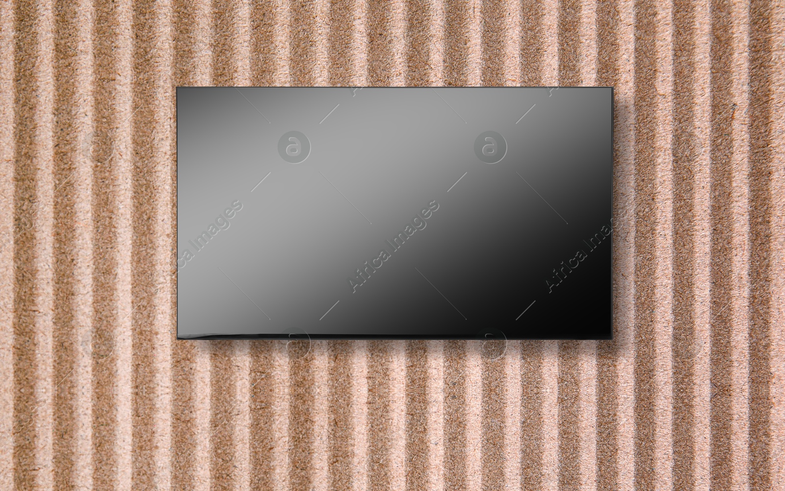 Image of Tv set with flat screen mounted on wall