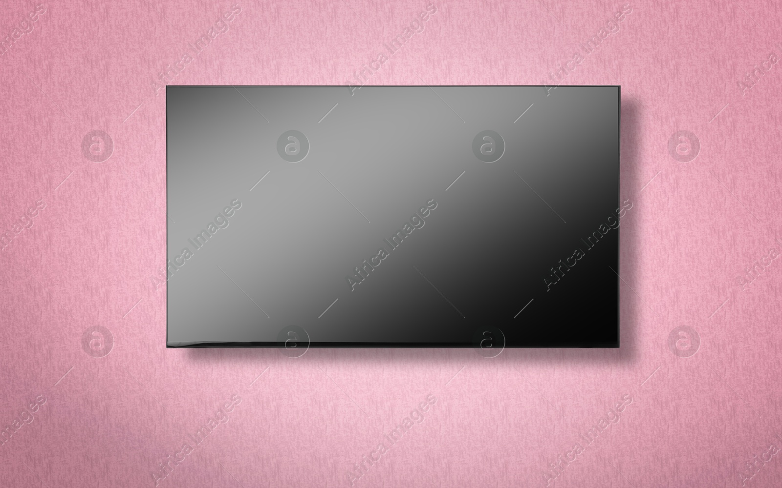 Image of Tv set with flat screen mounted on wall