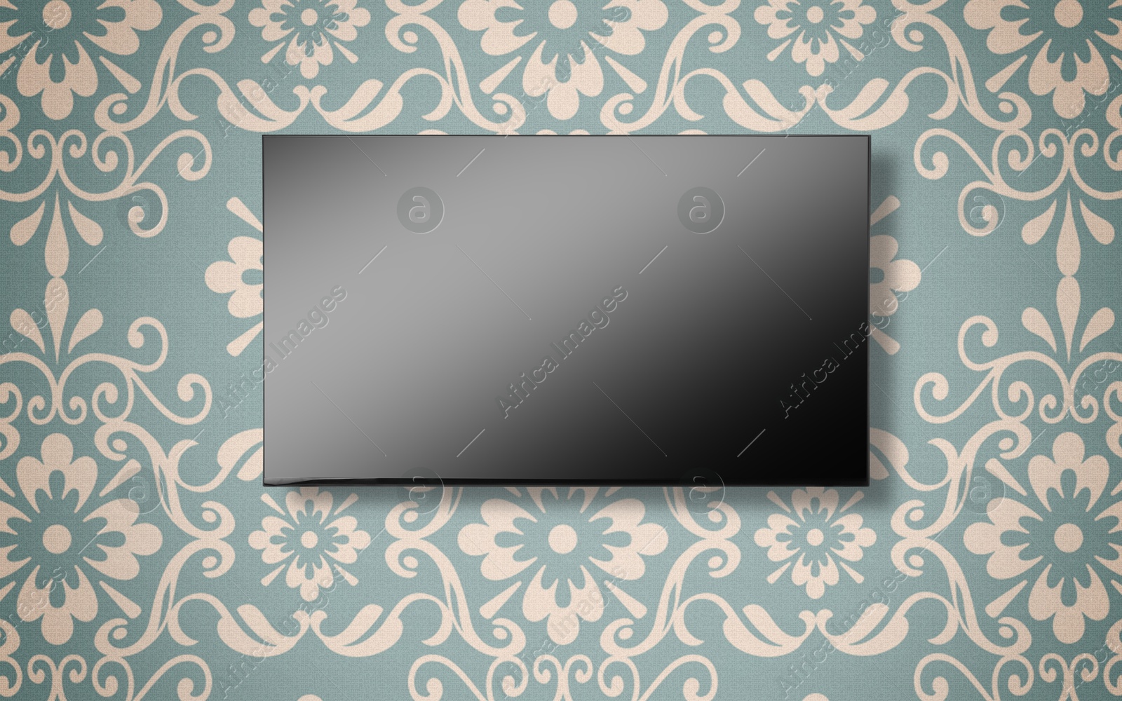 Image of Tv set with flat screen mounted on wall