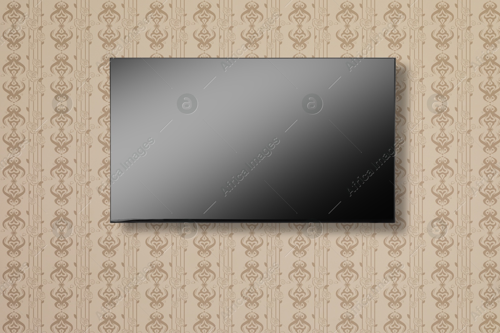 Image of Tv set with flat screen mounted on wall