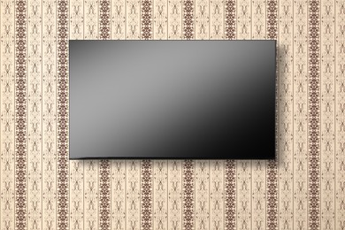 Image of Tv set with flat screen mounted on wall