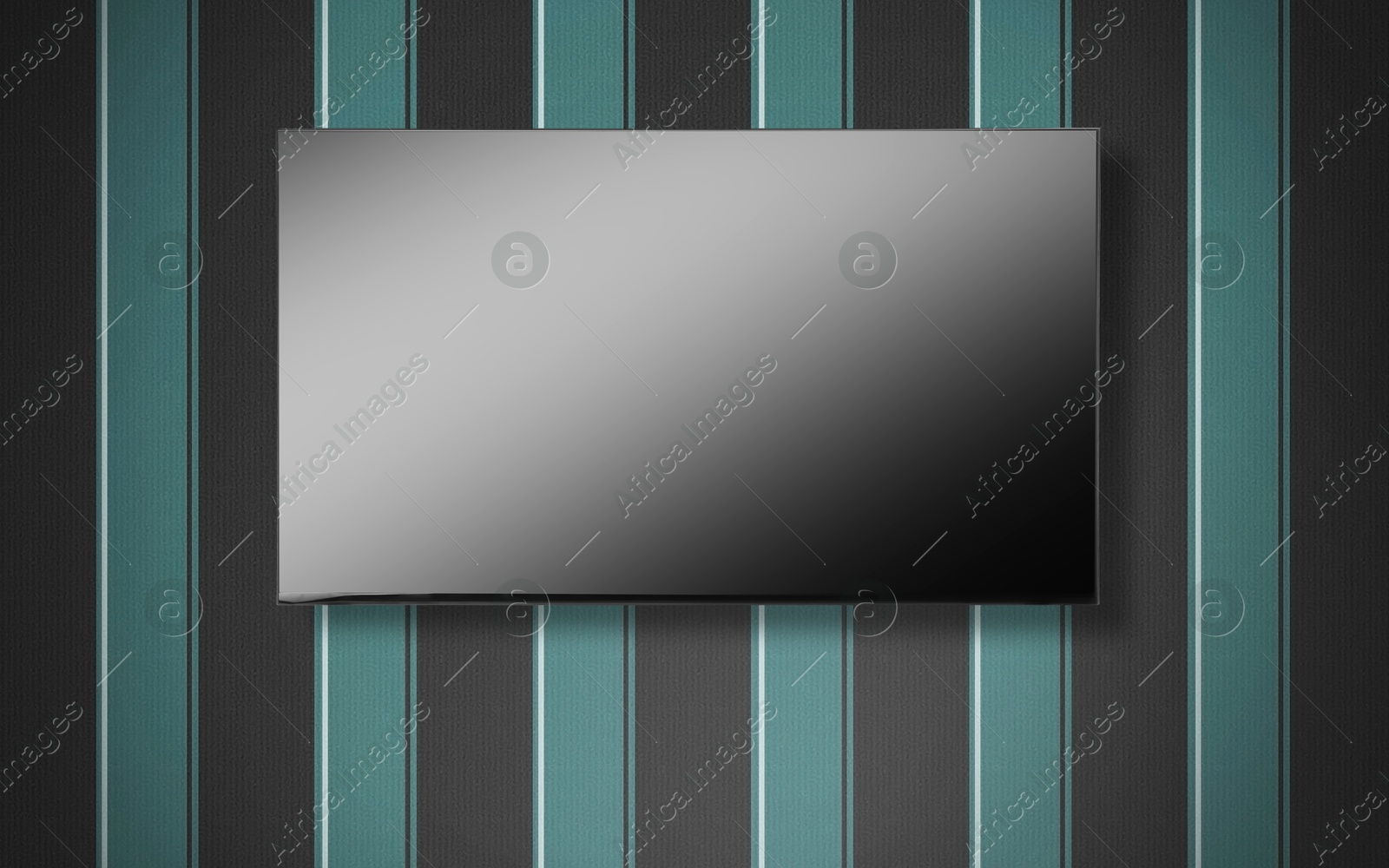 Image of Tv set with flat screen mounted on wall