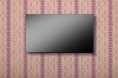 Image of Tv set with flat screen mounted on wall