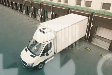 Truck near loading dock of warehouse outdoors, aerial view. Logistics center