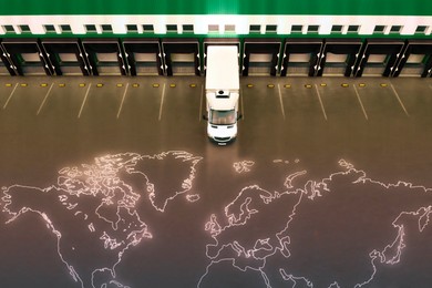 Image of Truck near loading dock of warehouse outdoors, aerial view. Logistics center. World map on asphalt