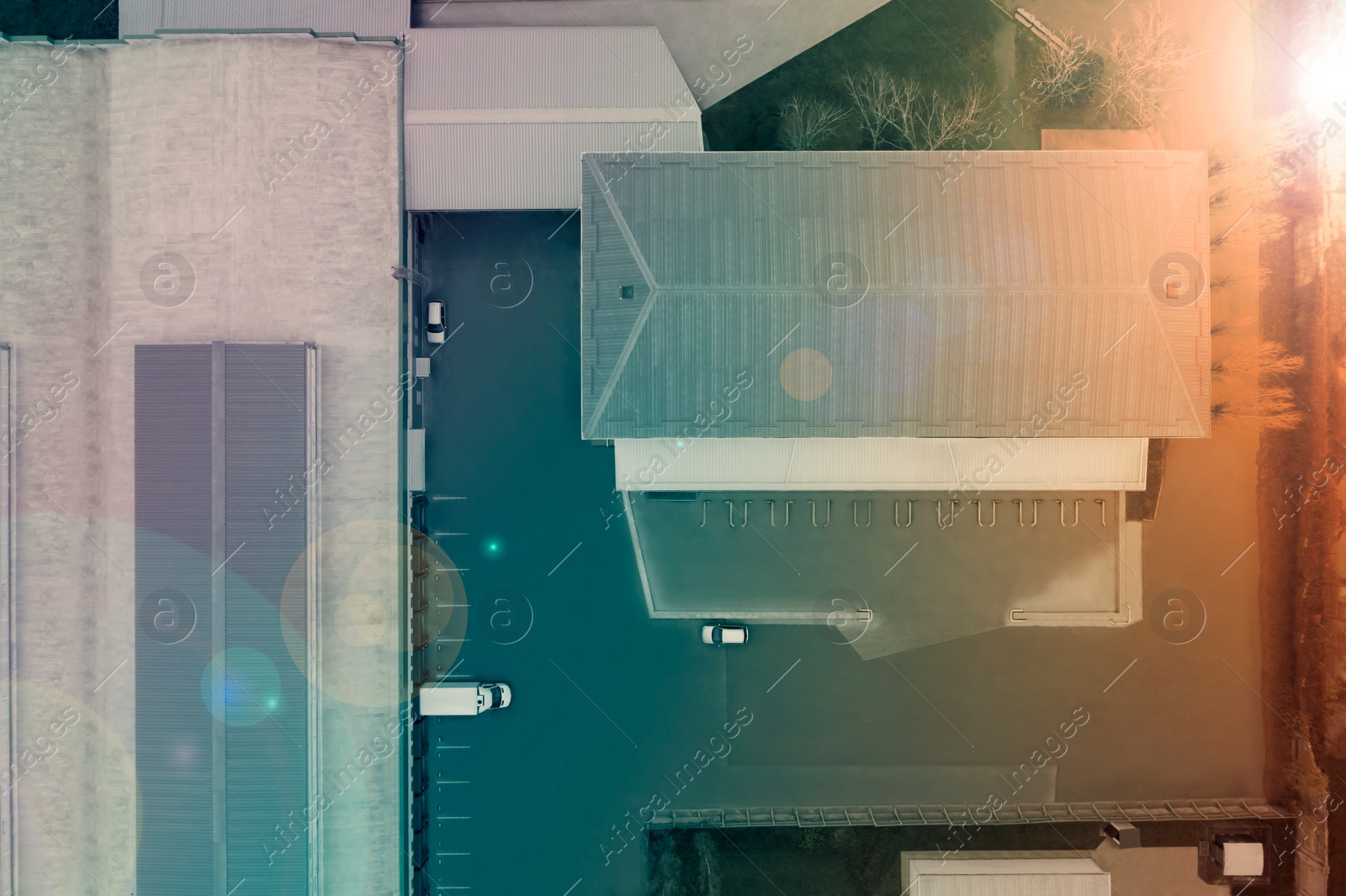 Image of Aerial top view of warehouse, color toned. Logistics center