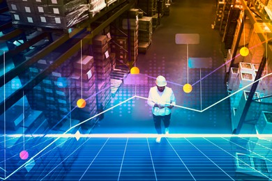 Man with tablet working at warehouse, above view. Logistics center. Graph