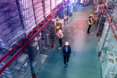 Image of Manager and workers at warehouse, above view. Logistics center. Color toned