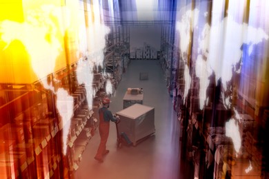 Image of Man in hardhat working with pallet truck at warehouse. Logistics center. World maps on racks with goods