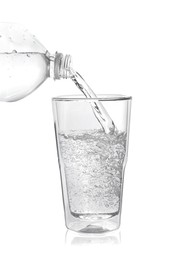 Photo of Pouring soda water from bottle into glass on white background