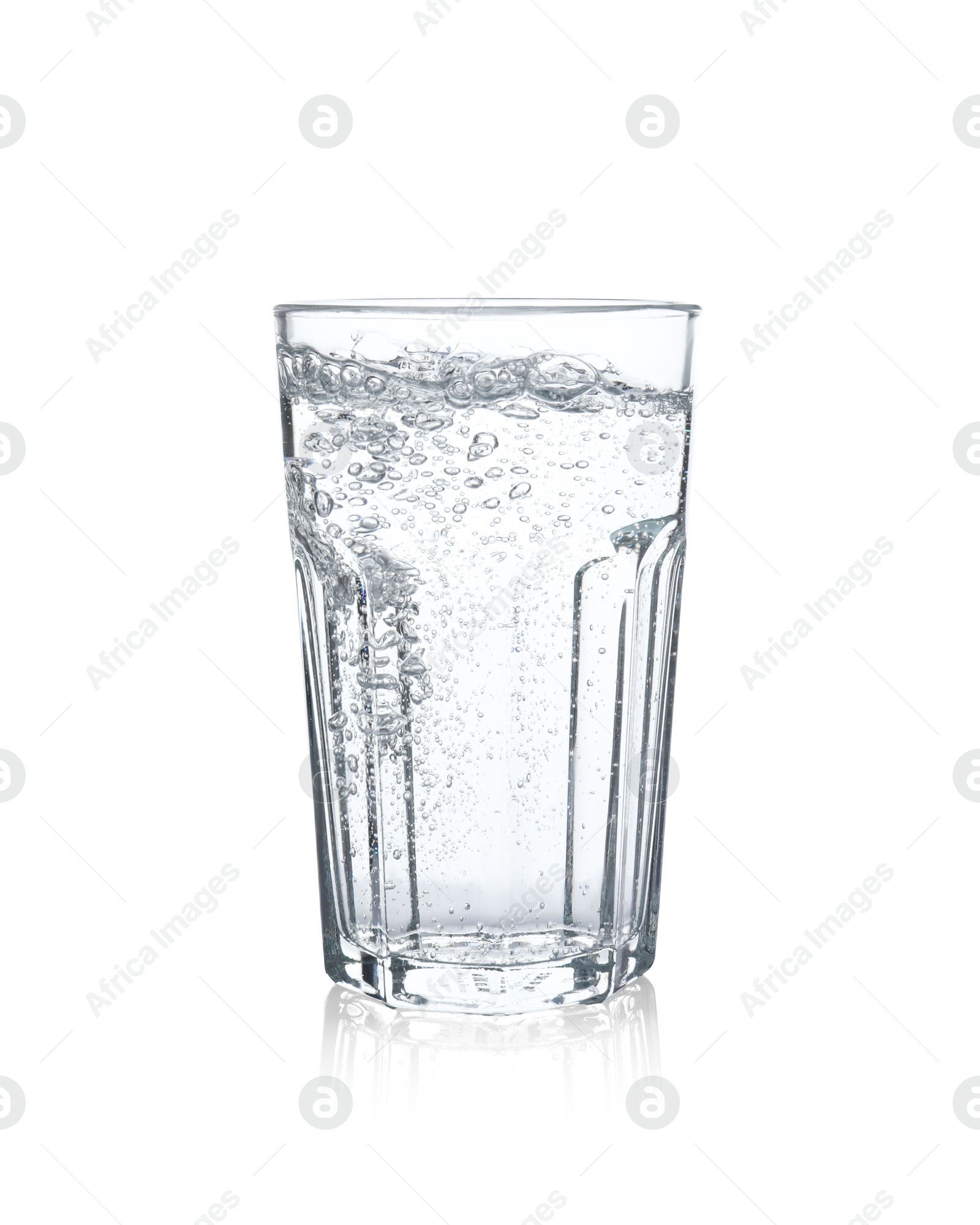 Photo of Pouring soda water from bottle into glass on white background