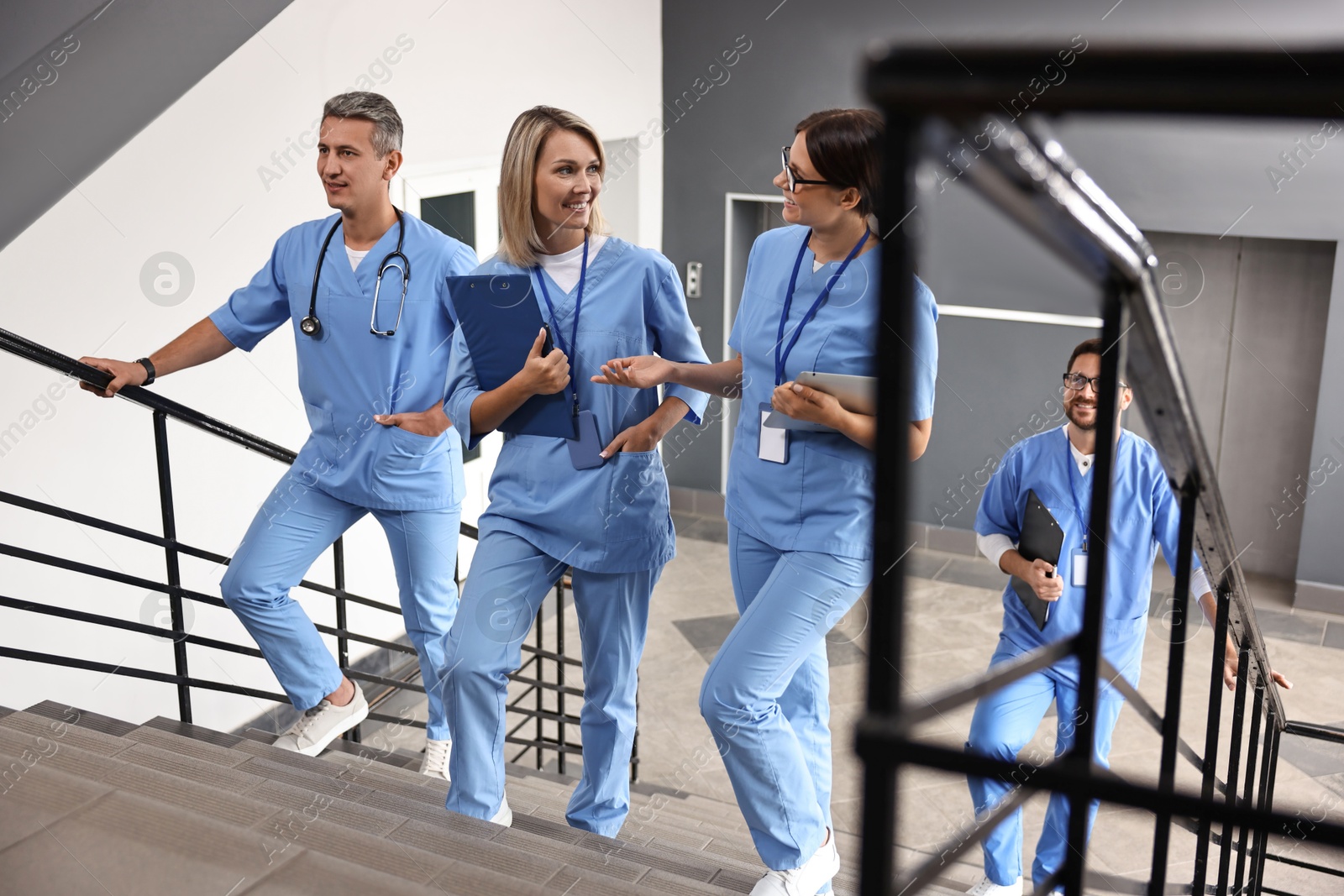 Photo of Healthcare workers walking up stairs in hospital