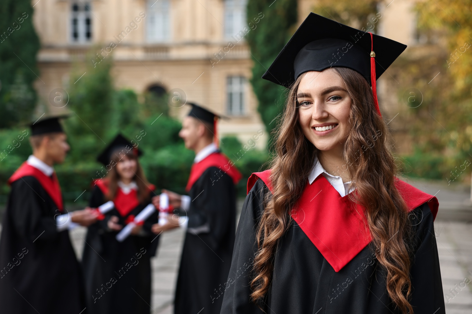 Photo of Graduation ceremony. Happy students outdoors, selective focus