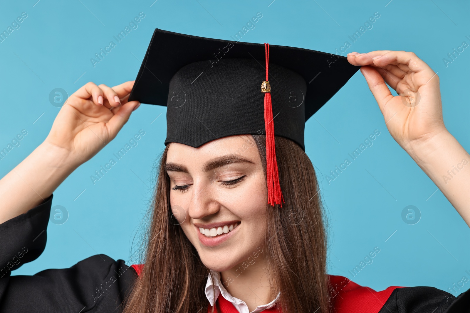 Photo of Happy student after graduation on light blue background