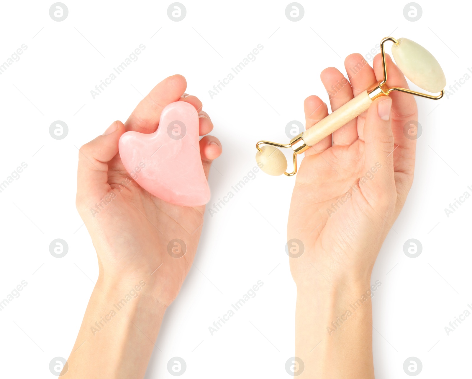 Photo of Woman with face roller and gua sha tool on white background, top view