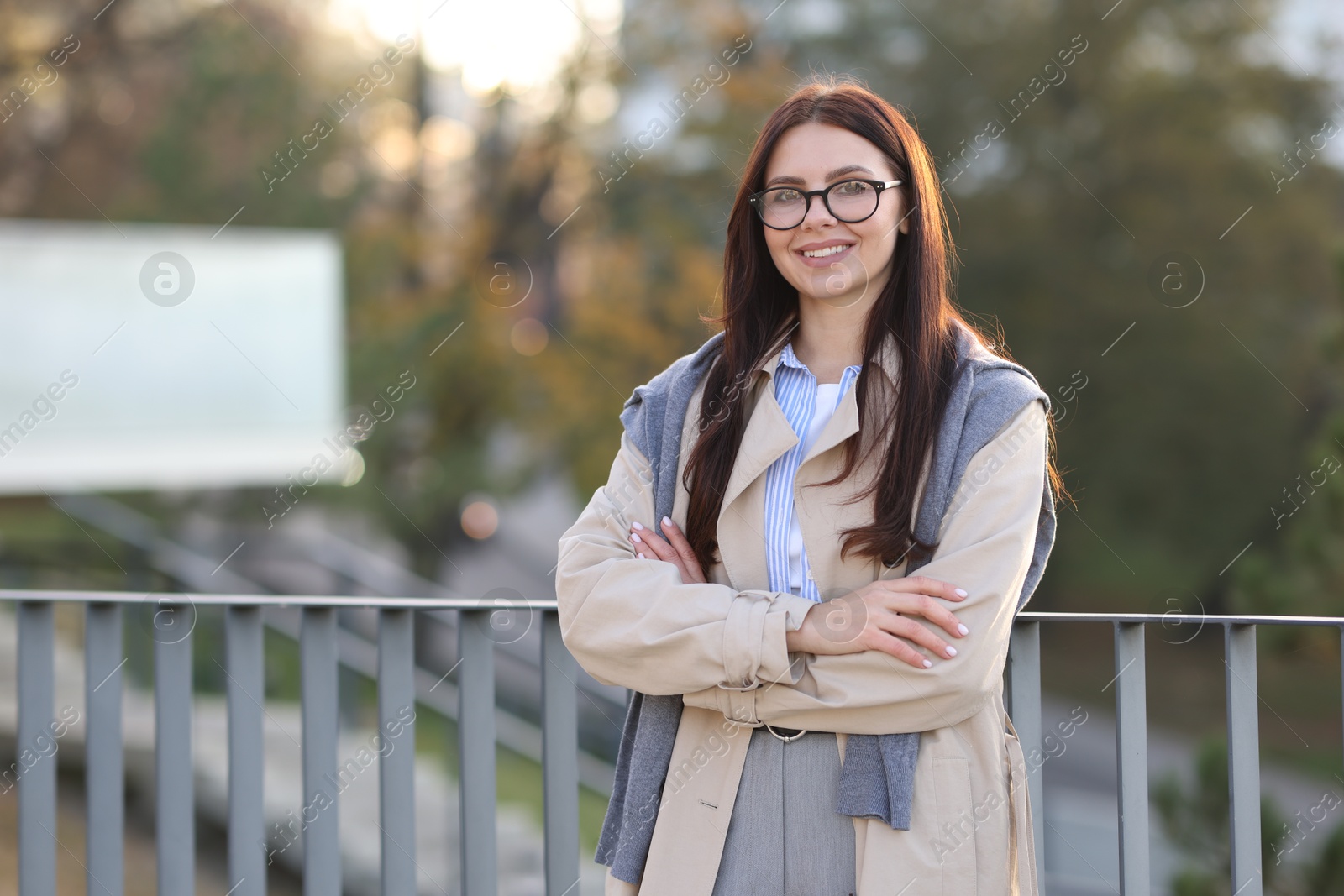 Photo of Beautiful woman in stylish suit outdoors. Space for text