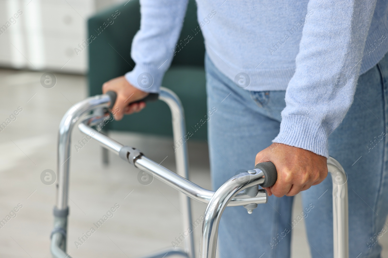 Photo of Senior woman with walking frame at home, closeup