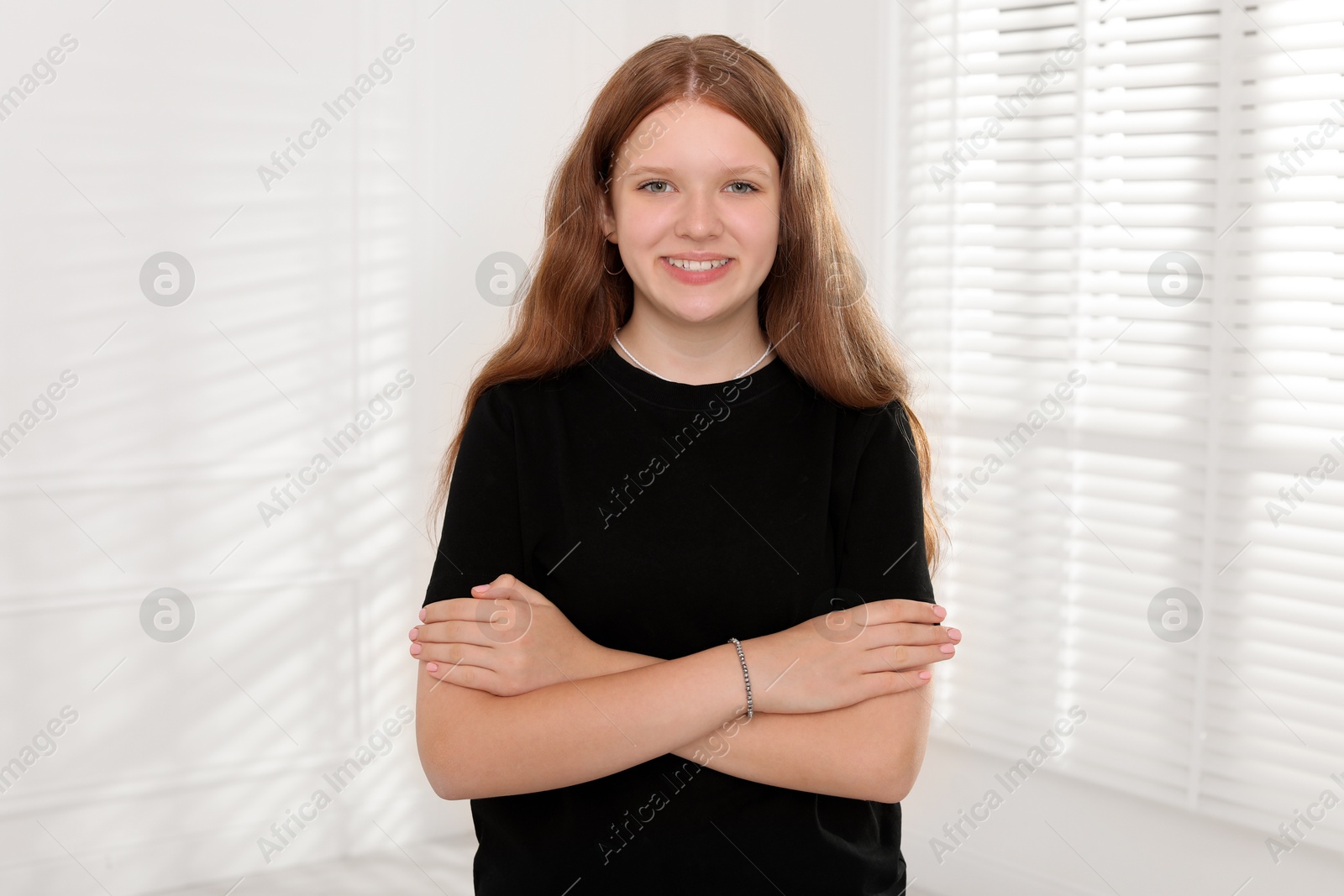 Photo of Portrait of happy teenage girl at home