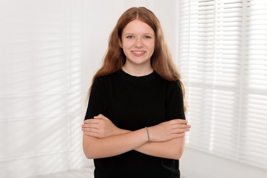 Photo of Portrait of happy teenage girl at home