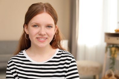 Photo of Portrait of happy teenage girl at home