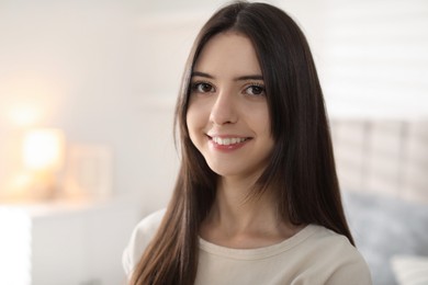 Photo of Portrait of happy teenage girl at home