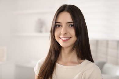 Photo of Portrait of happy teenage girl at home