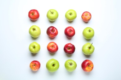 Photo of Red and green apples on white background, flat lay