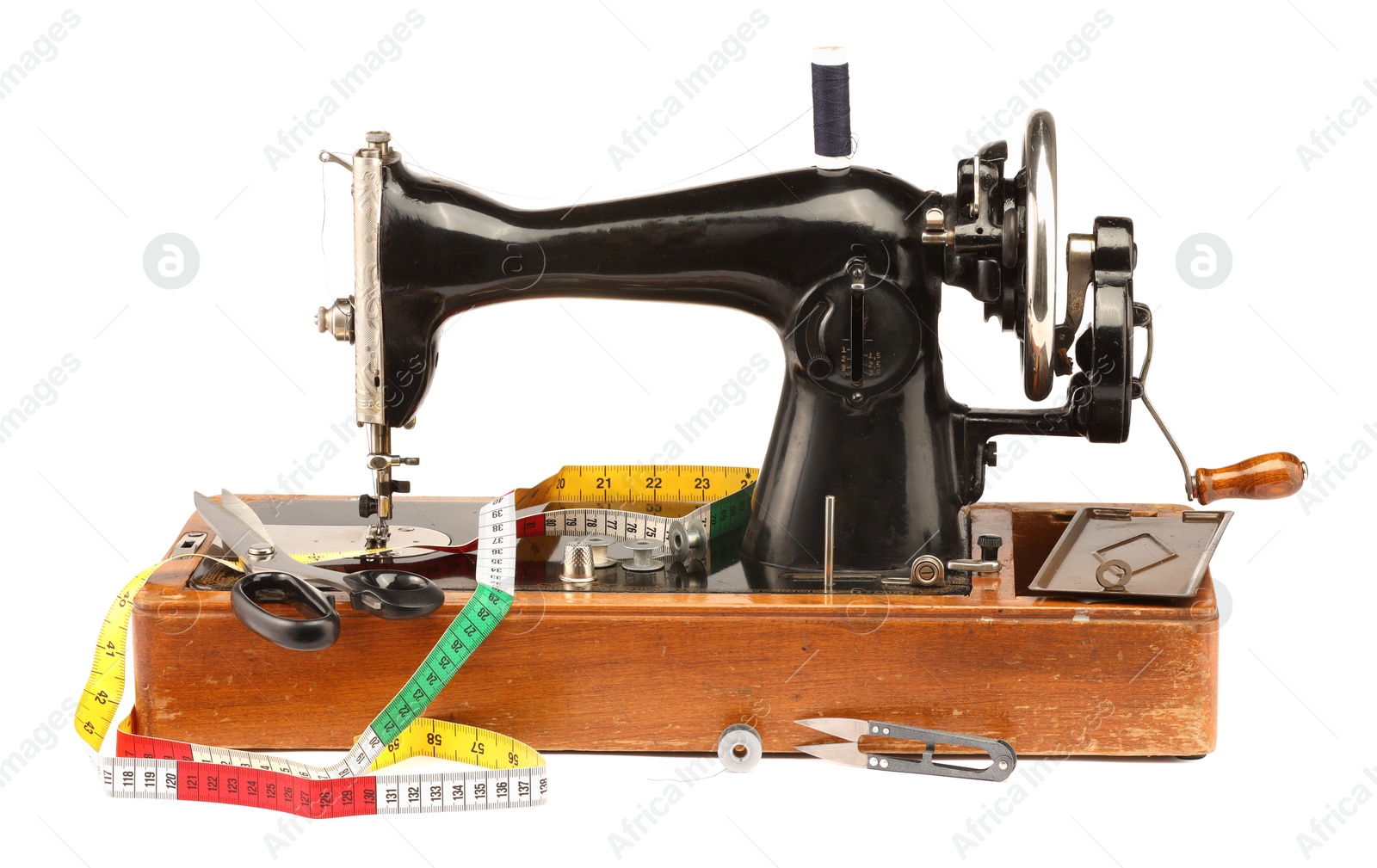 Photo of Sewing machine and other supplies isolated on white