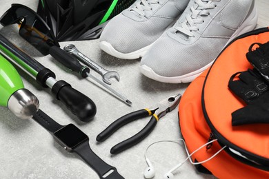 Photo of Bicycle accessories and tools on grey textured table