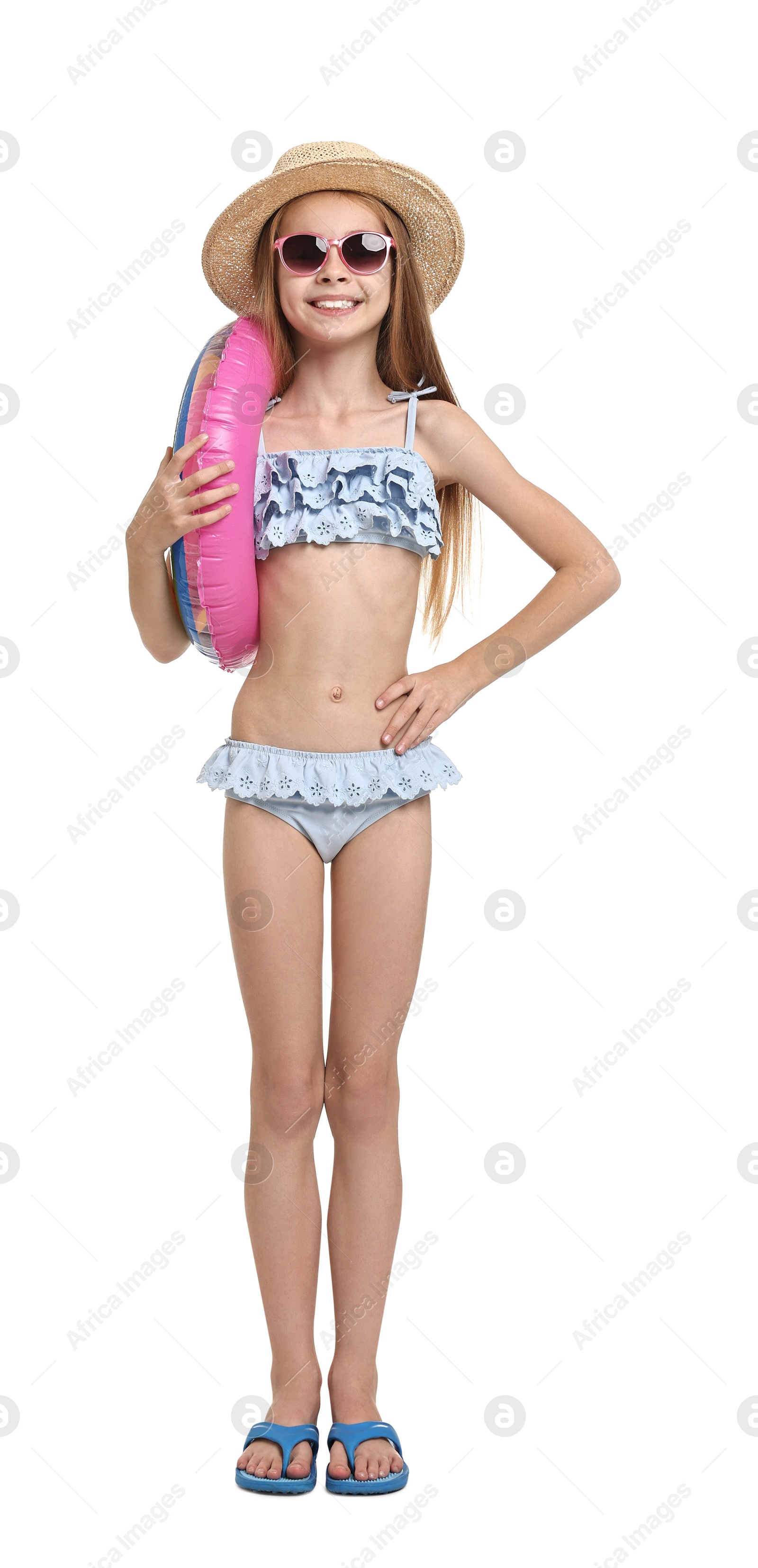 Photo of Little girl in beachwear with inflatable ring on white background