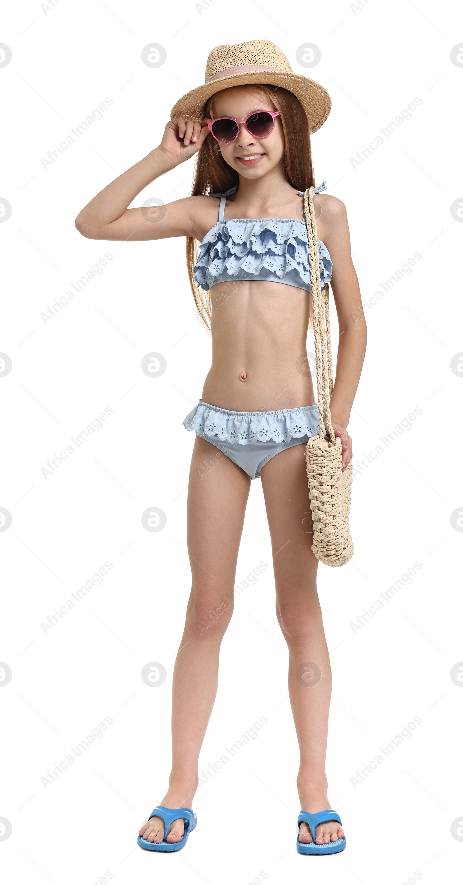 Photo of Little girl in beachwear with bag on white background