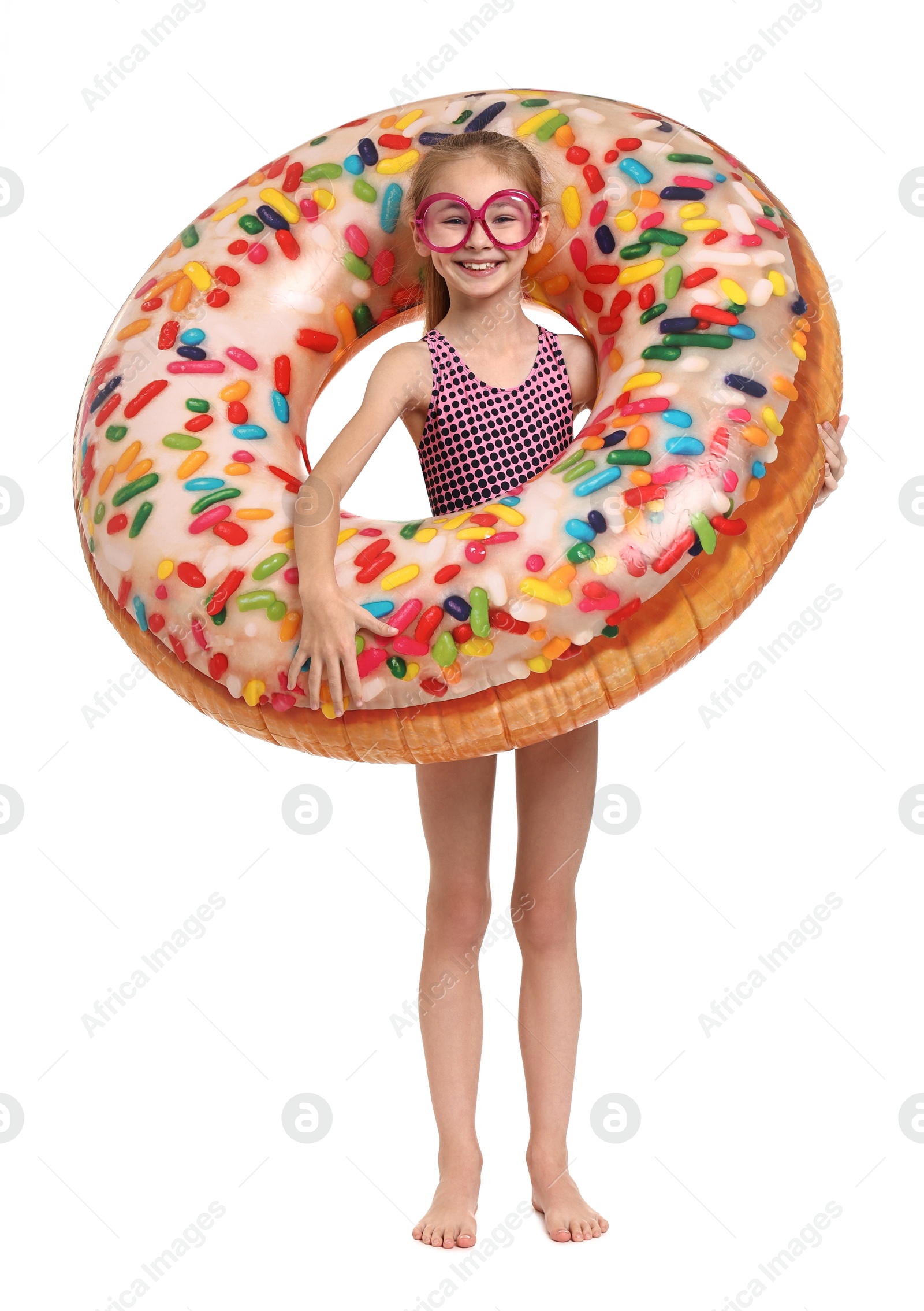 Photo of Happy girl in beachwear with inflatable ring on white background