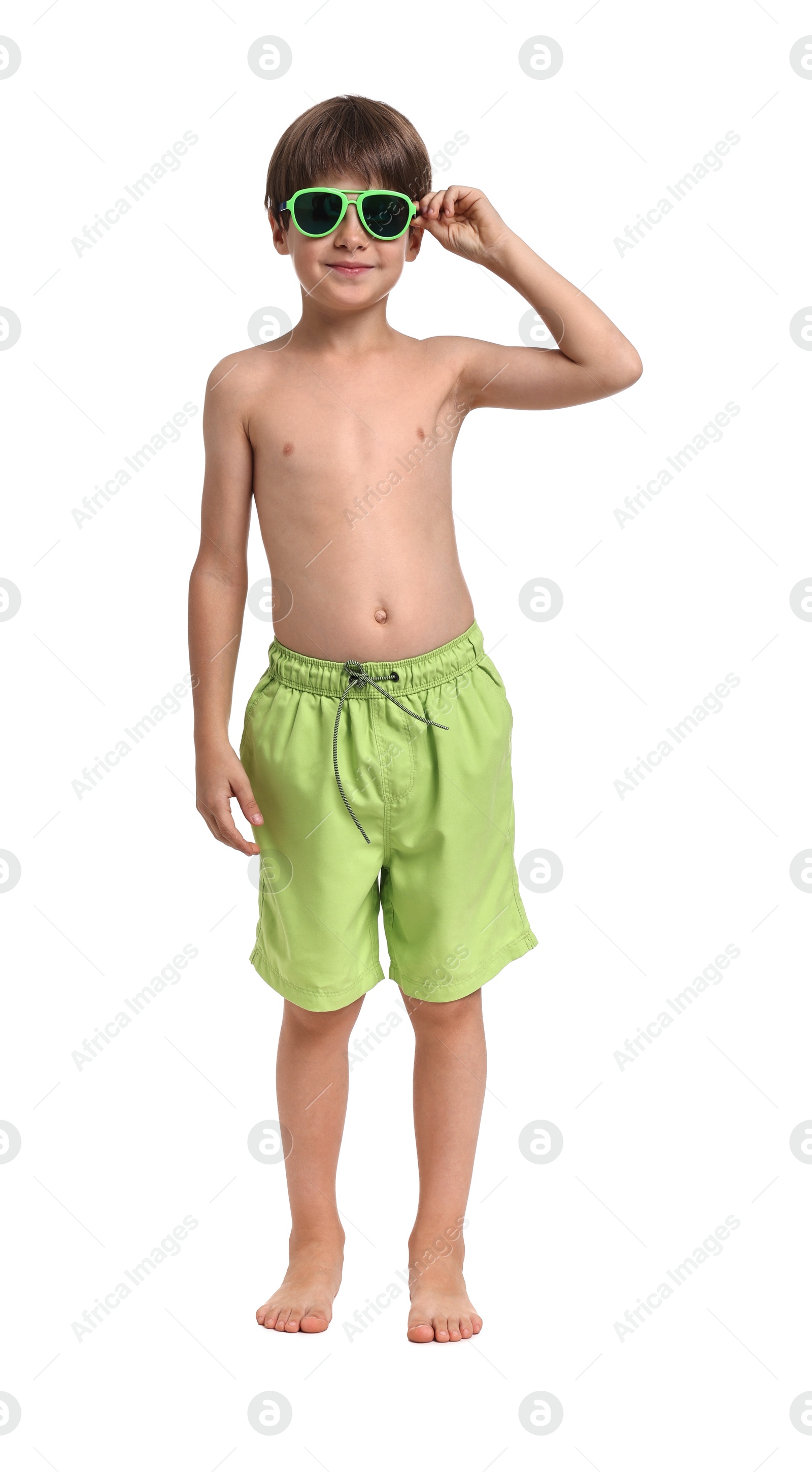 Photo of Little boy in beachwear and sunglasses on white background