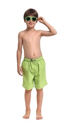 Photo of Little boy in beachwear and sunglasses on white background