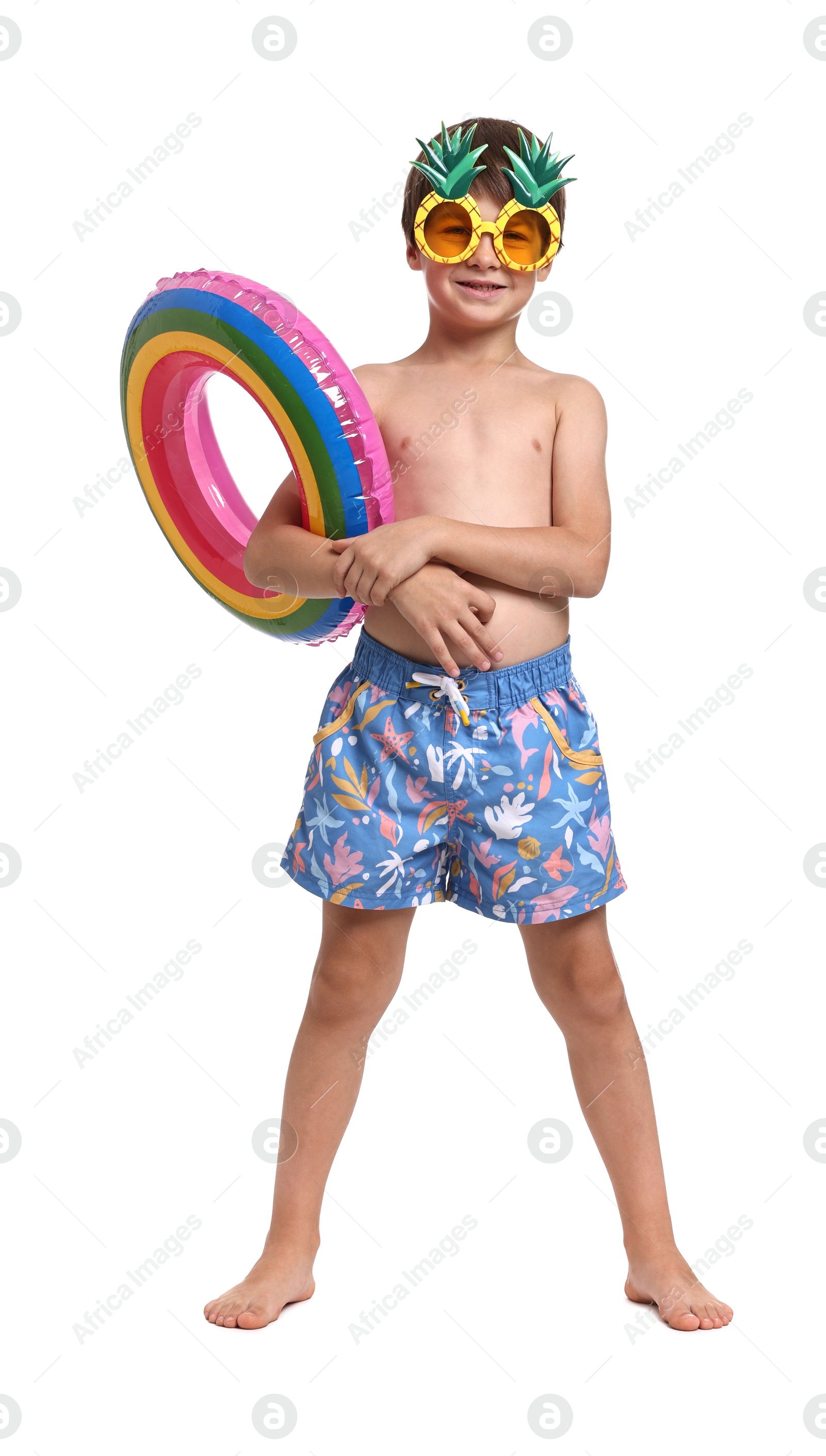 Photo of Little boy in beachwear with inflatable ring on white background