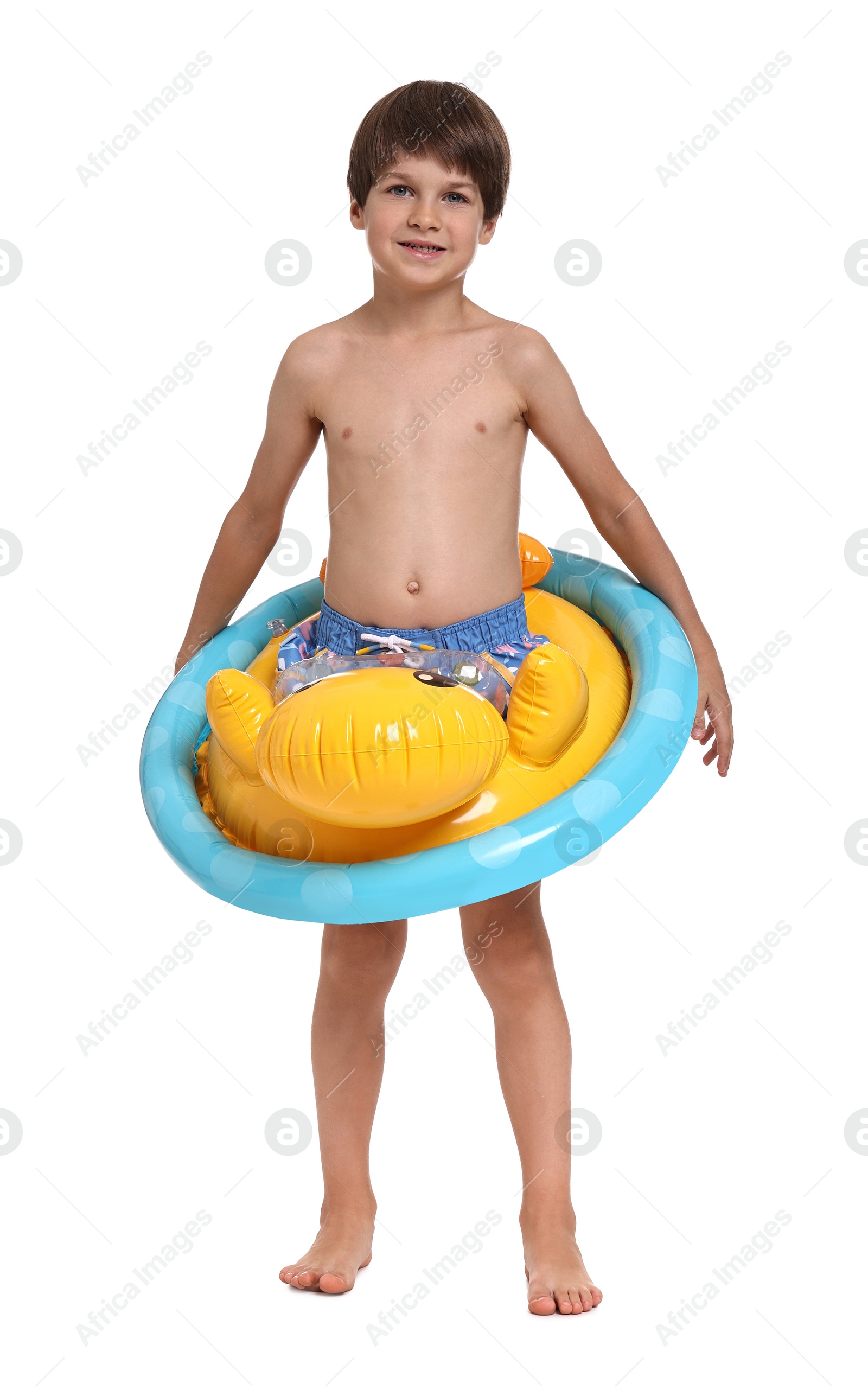 Photo of Little boy in beachwear with inflatable ring on white background