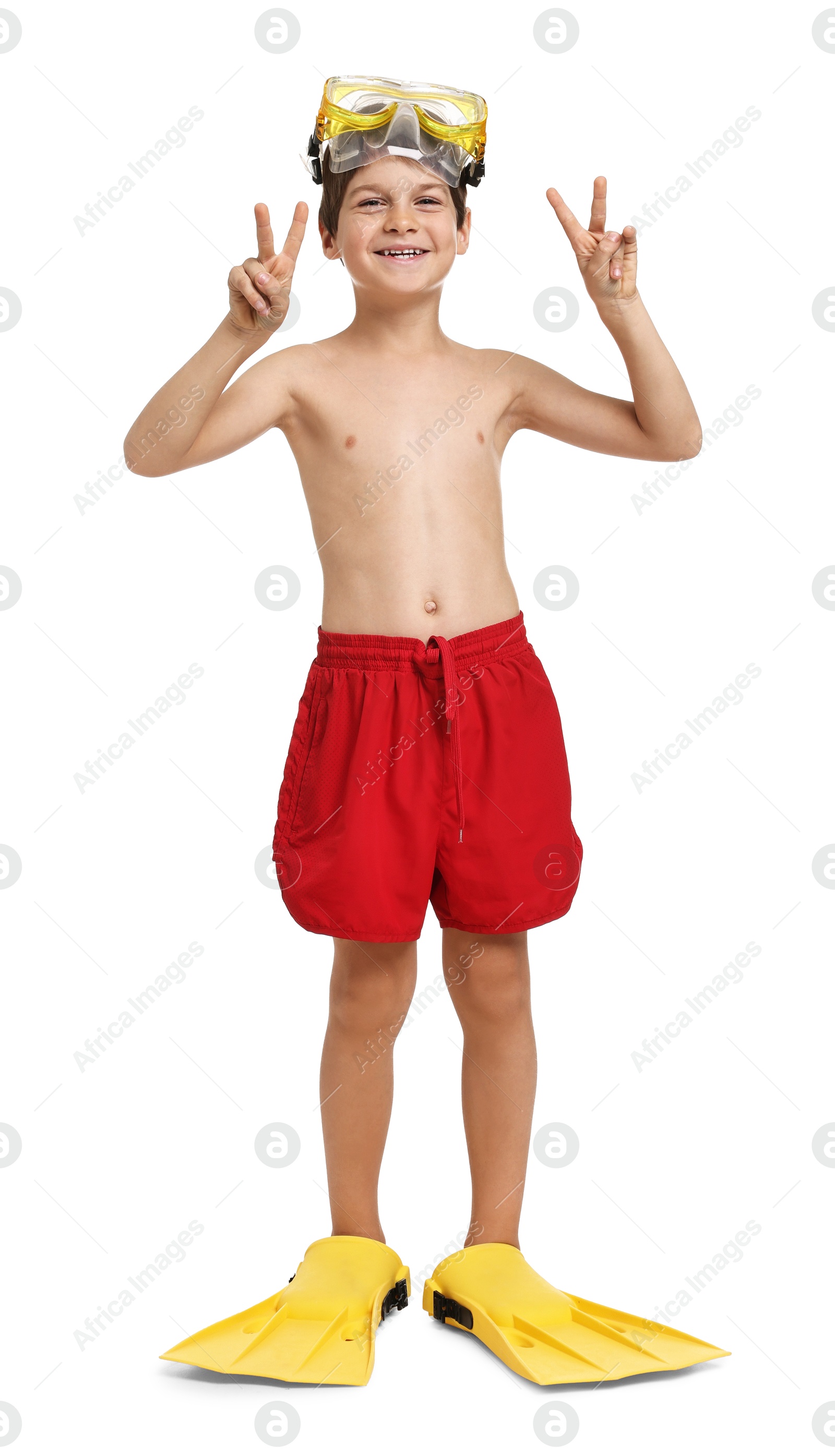 Photo of Little boy in beachwear with diving mask and flippers on white background