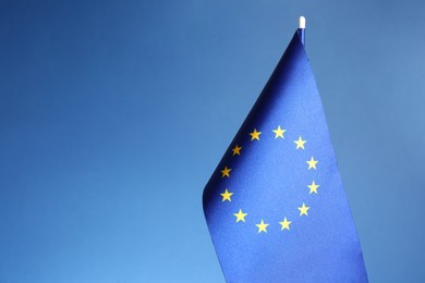 Photo of One flag of European Union on blue background. Space for text