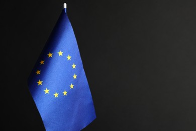 Photo of One flag of European Union on black background. Space for text