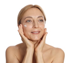 Smiling woman with cream on face against white background