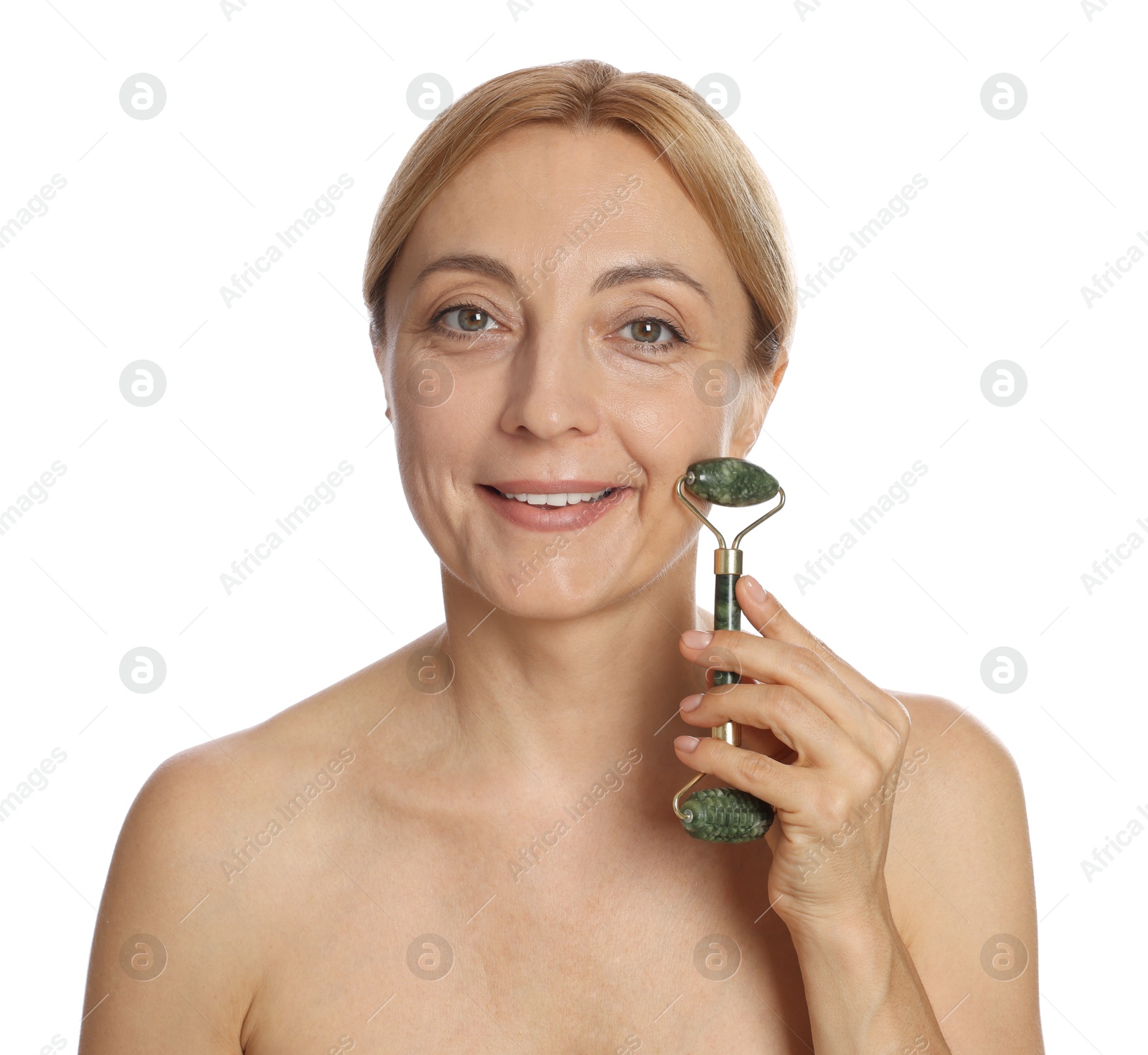 Photo of Smiling woman doing facial self massage with roller on white background