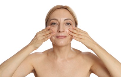 Photo of Beautiful woman doing facial self massage on white background